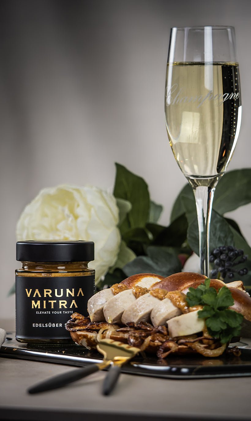 Weißwurst auf Laugenstange mit süßem Senf und Sekt